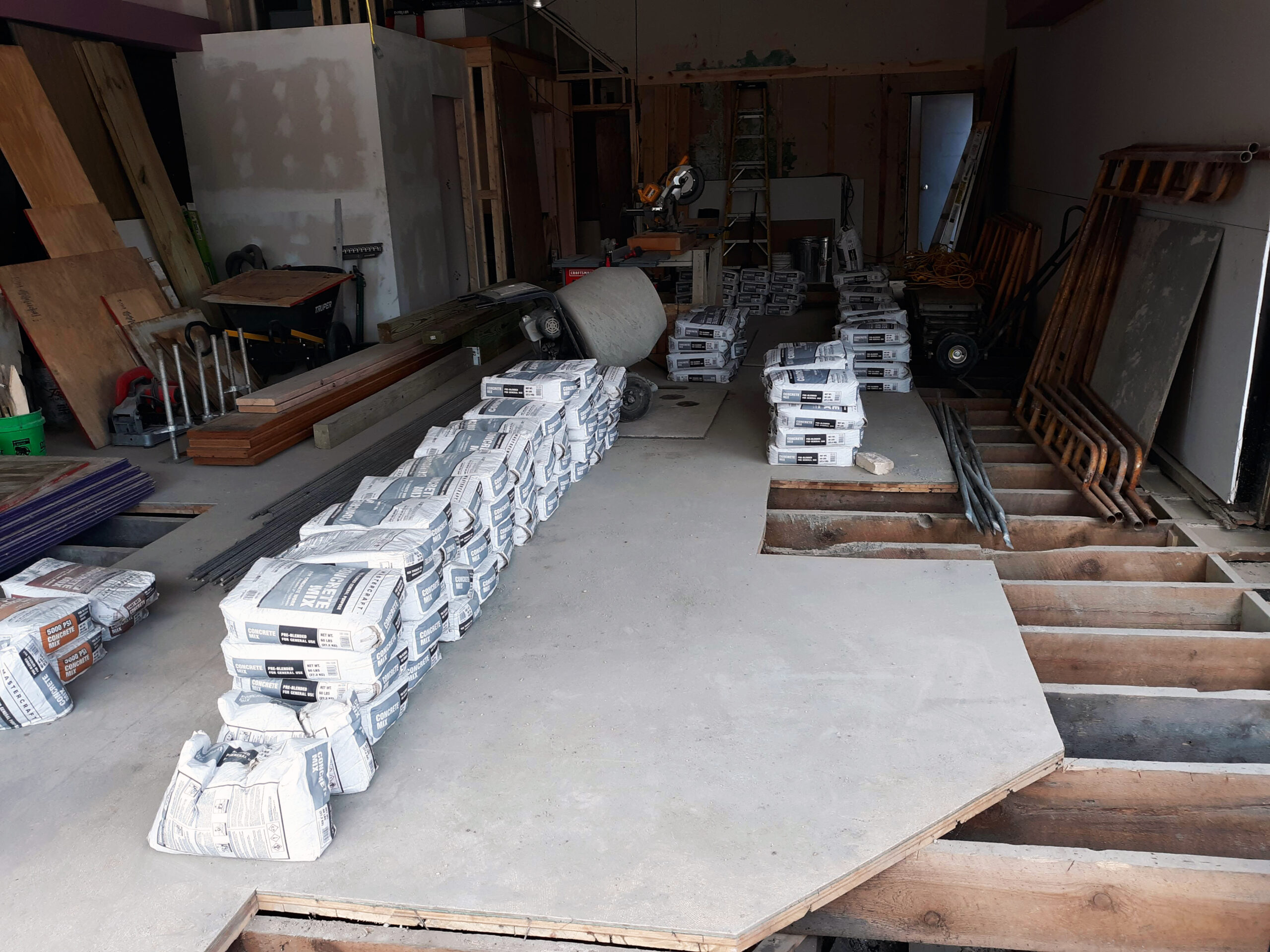 A stack of raw lumber, emphasizing the importance of sourcing high-quality materials to mitigate risks related to structural integrity and project delays in commercial construction.